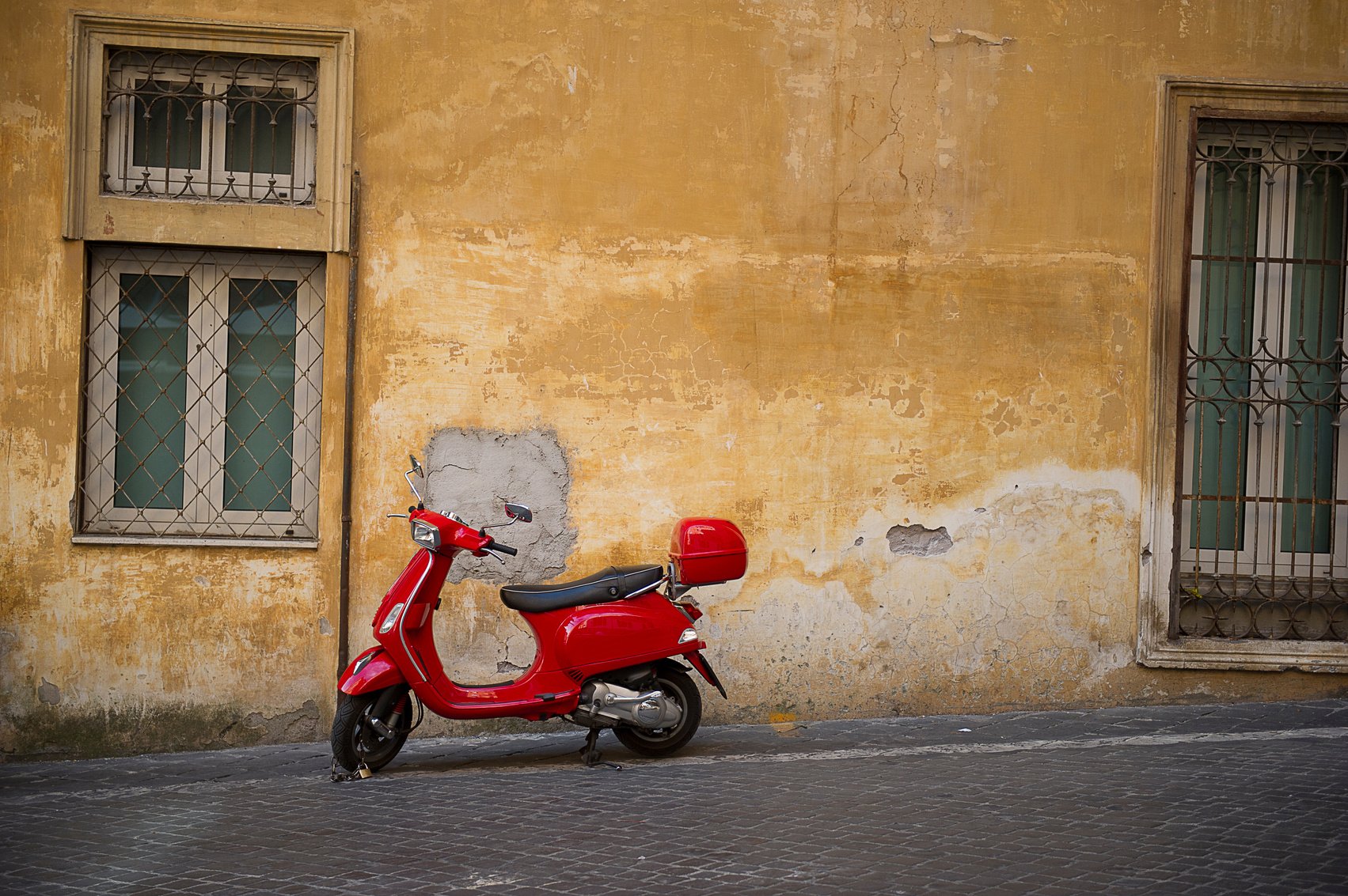 Bright Red Vespa Scooter in an Urban Street